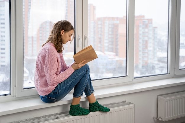 full-shot-woman-reading-book-home_23-2149308985-2164654