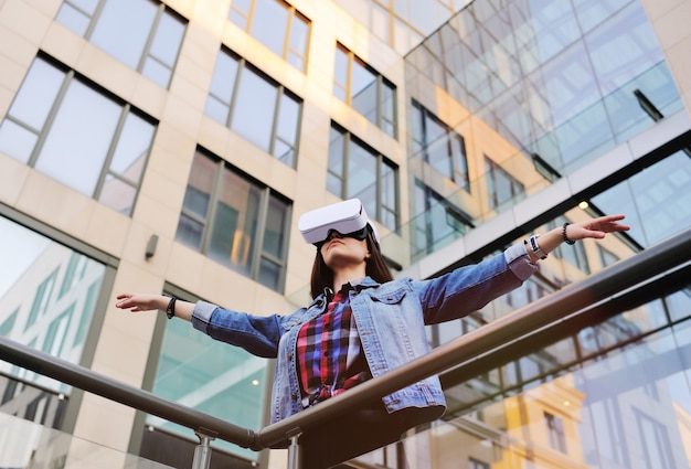 young-woman-with-long-hair-vr-glasses-modern-glass-building_74906-1321-2741642